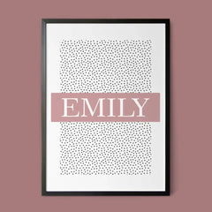 Framed artwork with the name "Emily" in bold white letters on a pink band, set against a dotted pattern background.