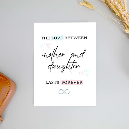 Mother and daughter card with love quote, pastel hearts, infinity symbol, and wheat decor