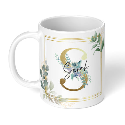 Close-up of a personalized mug featuring a floral design and elegant gold accents, perfect for gifting.