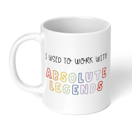 White mug with colorful text on a white background