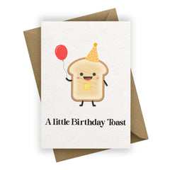 Birthday card with a cartoon toast character holding a balloon, on a white background.