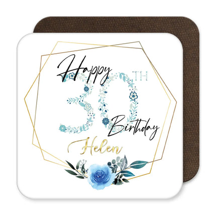 A blue floral coaster with the text "Happy 30th Birthday" printed on it.