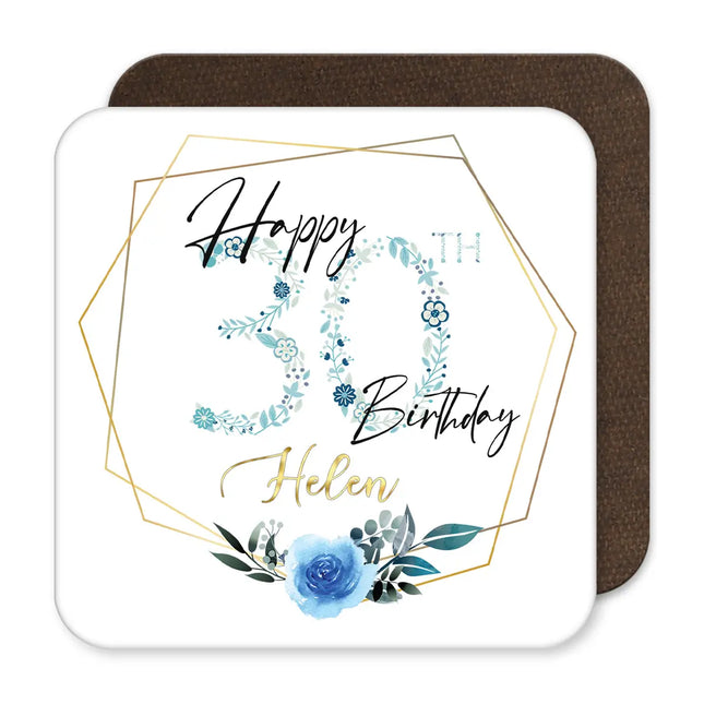 A blue floral coaster with the text "Happy 30th Birthday" printed on it.