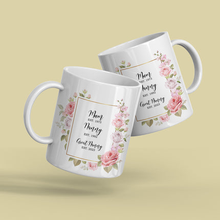 Two personalized floral mugs with "Mum, Nanny, Great Nanny" and establishment years printed on them.